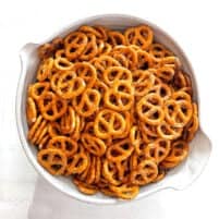 a white bowl filled with pretzel twists