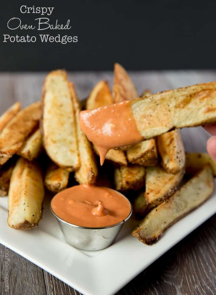 Crispy oven baked potato wedges with a spicy ketchup sriracha