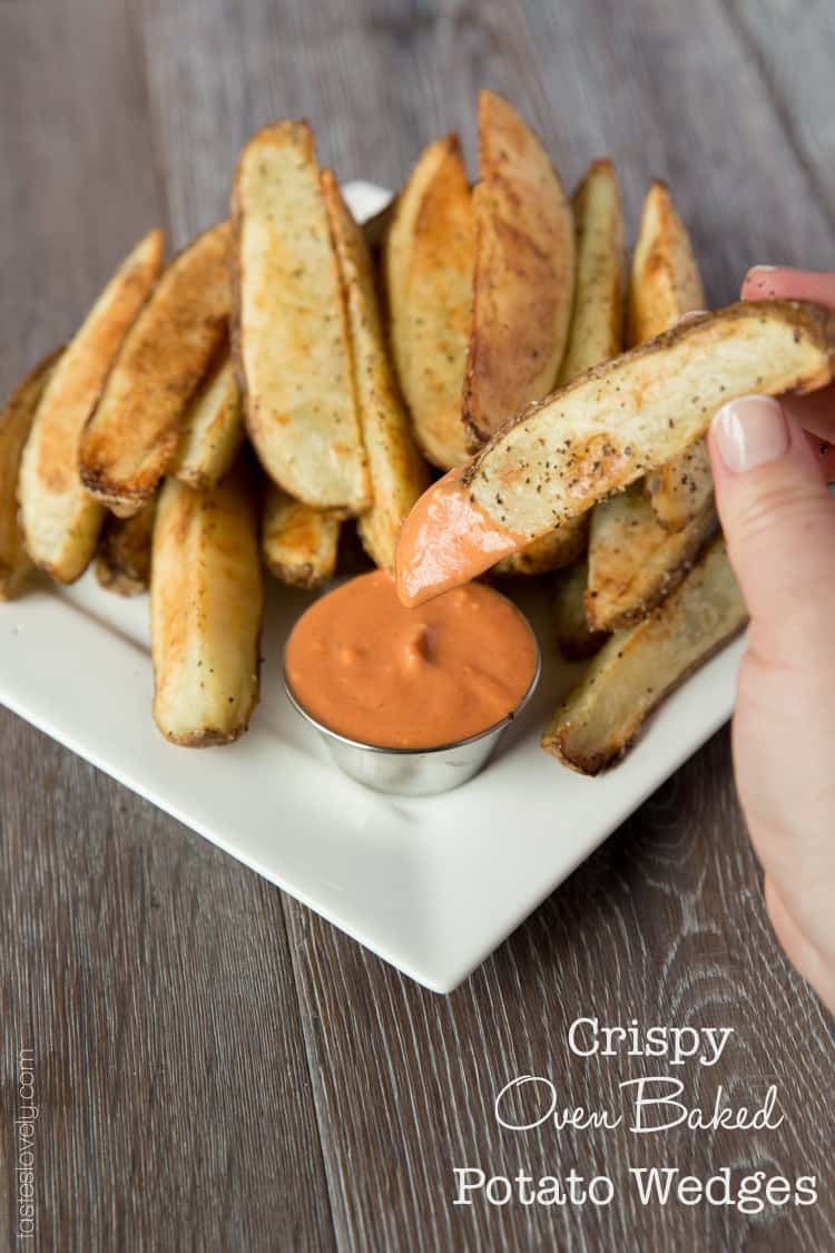 Crispy oven baked potato wedges with a spicy ketchup sriracha