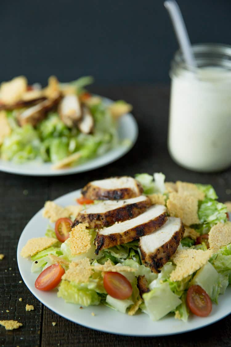 Lemon pepper chicken caesar salad with creamy caesar dressing and parmesan frico croutons