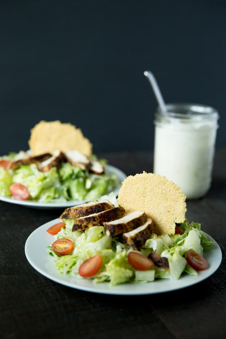 Lemon pepper chicken caesar salad with creamy caesar dressing and parmesan frico croutons