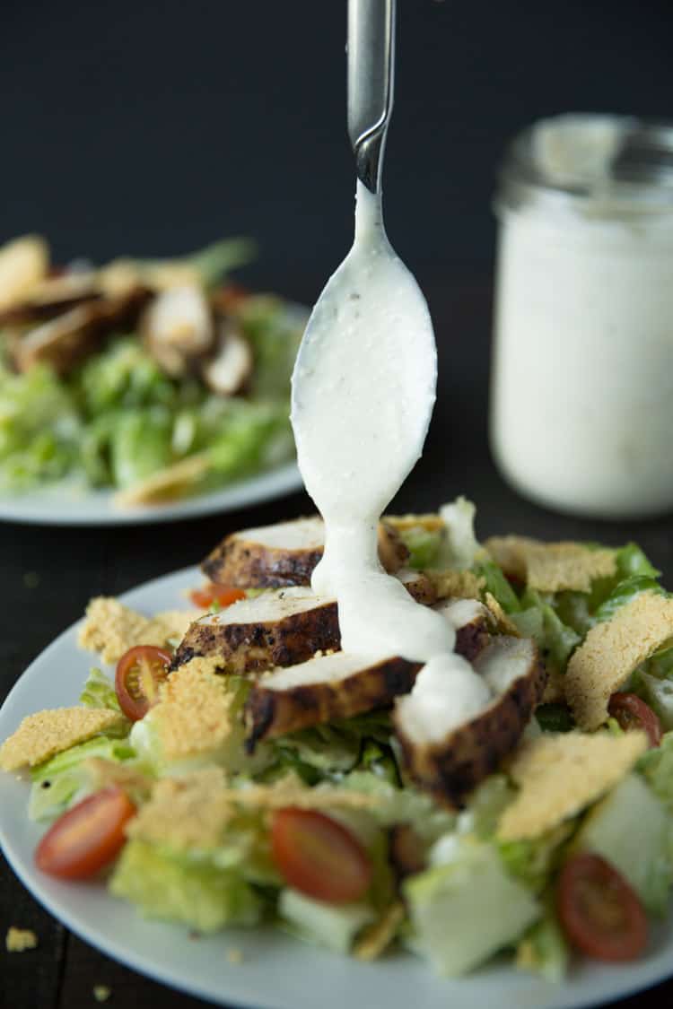 Lemon pepper chicken caesar salad with creamy caesar dressing and parmesan frico croutons