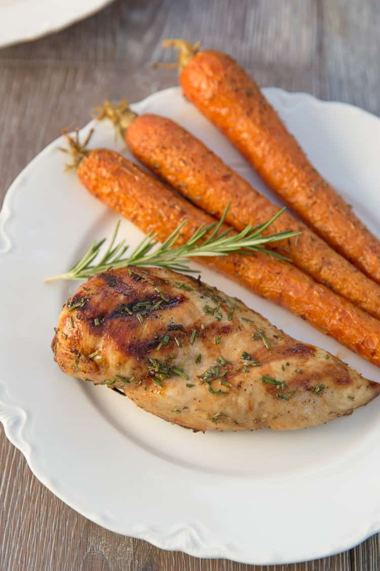 Grilled lemon rosemary chicken that has been marinated in white wine. Perfect light summer dinner!