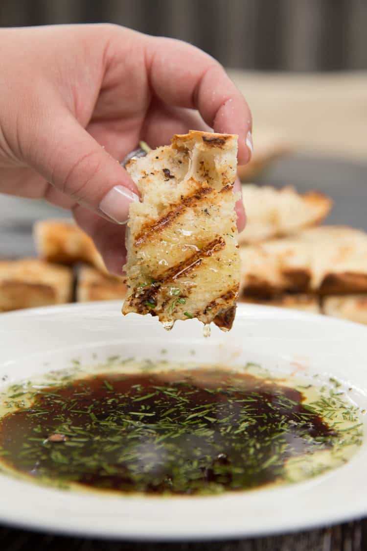 Garlic rubbed grilled bread with rosemary dipping oil. Perfect summer appetizer or side dish!