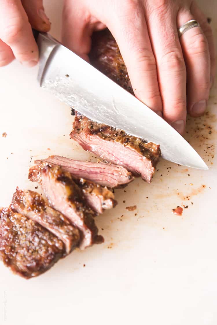 Skirt steak with chimichurri sauce - a delicious (and affordable!) steak dinner topped with a cilantro parsley mixture. #paleo #whole30 #glutenfree #lowcarb