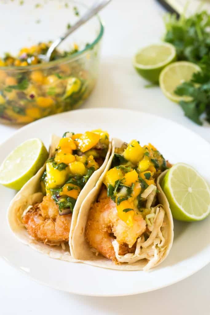 Tropical Coconut Shrimp Tacos with a chili lime coleslaw and mango papaya salsa - seriously the BEST taco I have ever had!