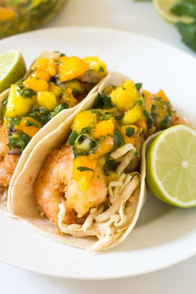 Tropical Coconut Shrimp Tacos with a chili lime coleslaw and mango papaya salsa - seriously the BEST taco I have ever had!