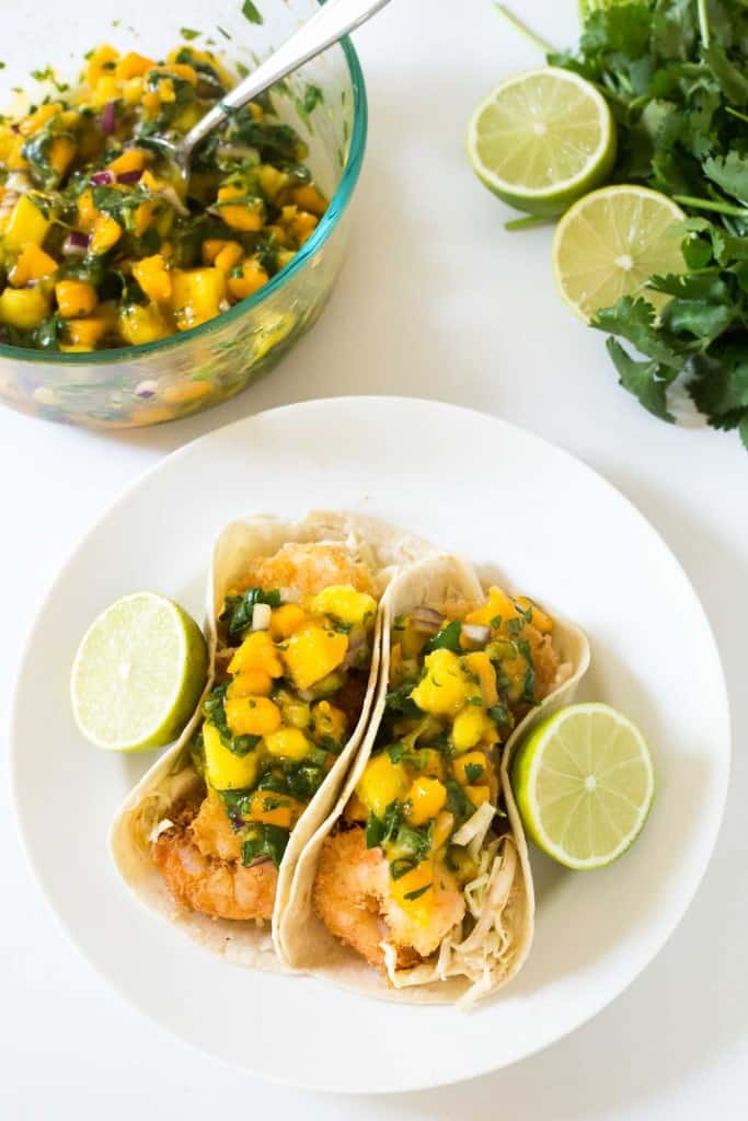 Tropical Coconut Shrimp Tacos with a chili lime coleslaw and mango papaya salsa - seriously the BEST taco I have ever had!