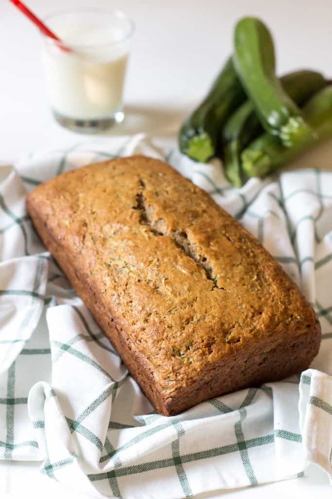 Healthy Zucchini Bread Recipe - made with half the amount of sugar, whole wheat flour, greek yogurt & coconut oil. A healthier zucchini bread you can enjoy without the guilt!