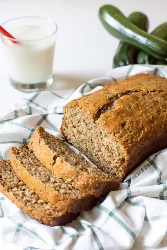 Healthy Zucchini Bread Recipe - made with half the amount of sugar, whole wheat flour, greek yogurt & coconut oil. A healthier zucchini bread you can enjoy without the guilt!