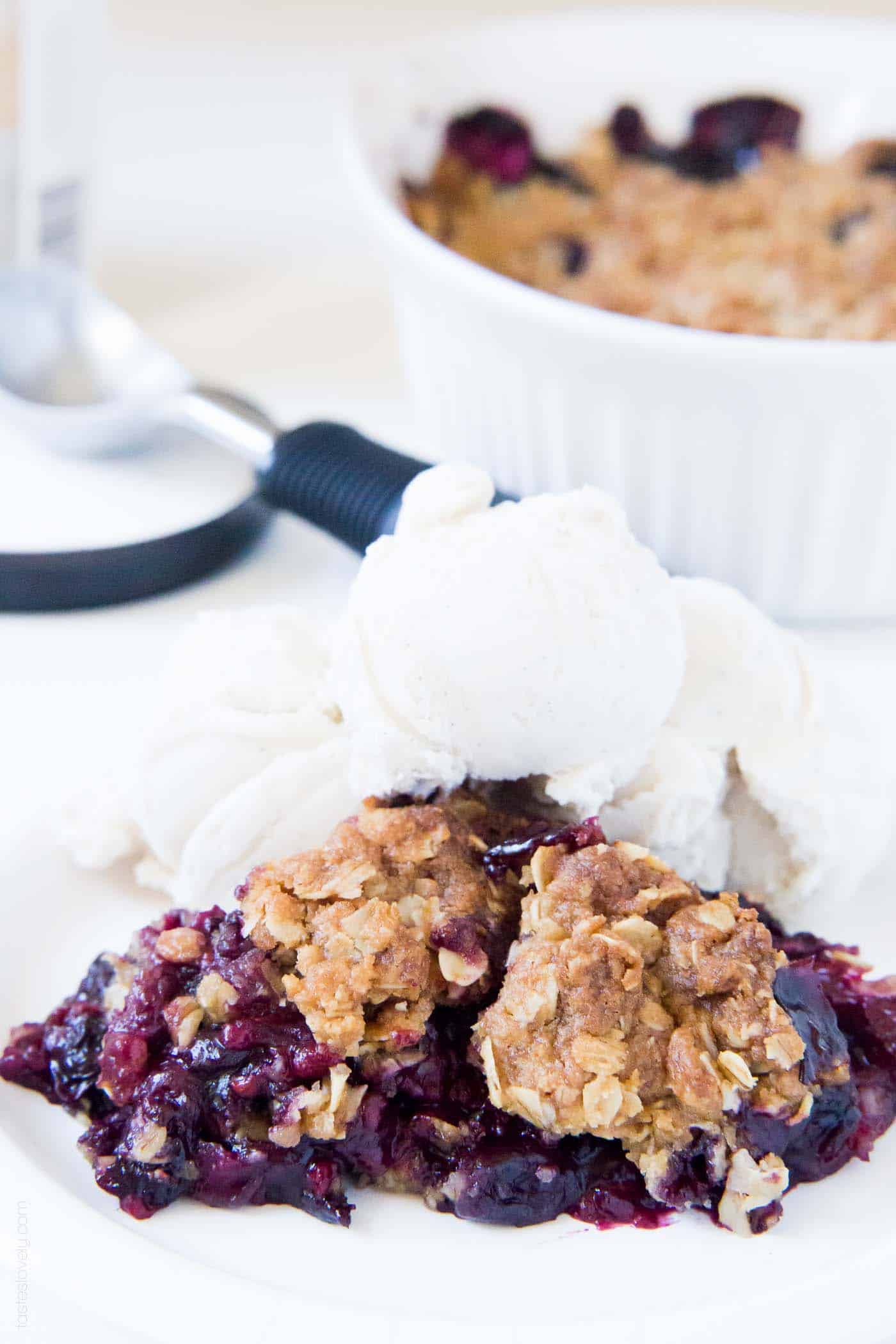 berry crumble recipe topped with ice cream