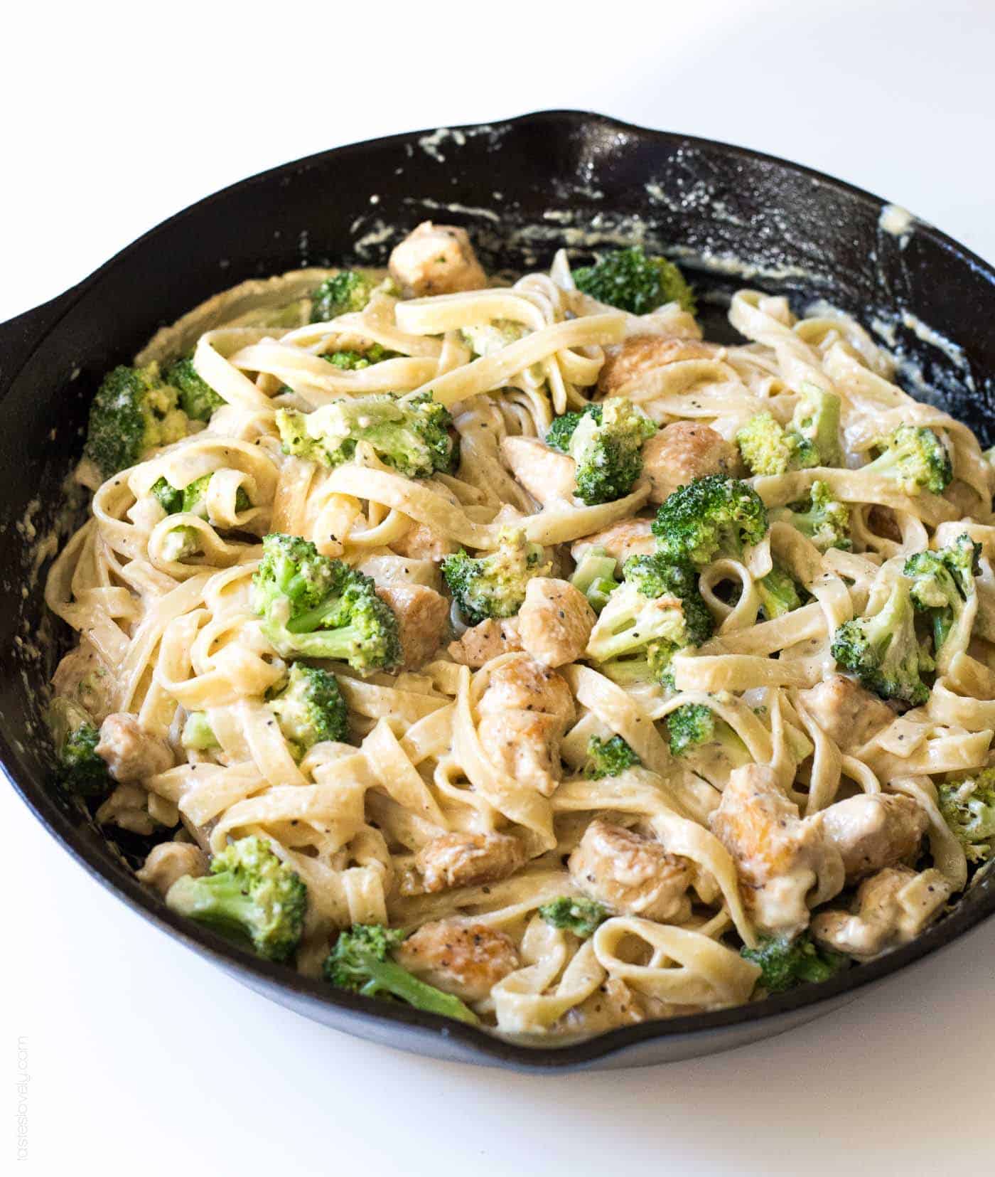 broccoli chicken fettucine alfredo in a cast iron skillet