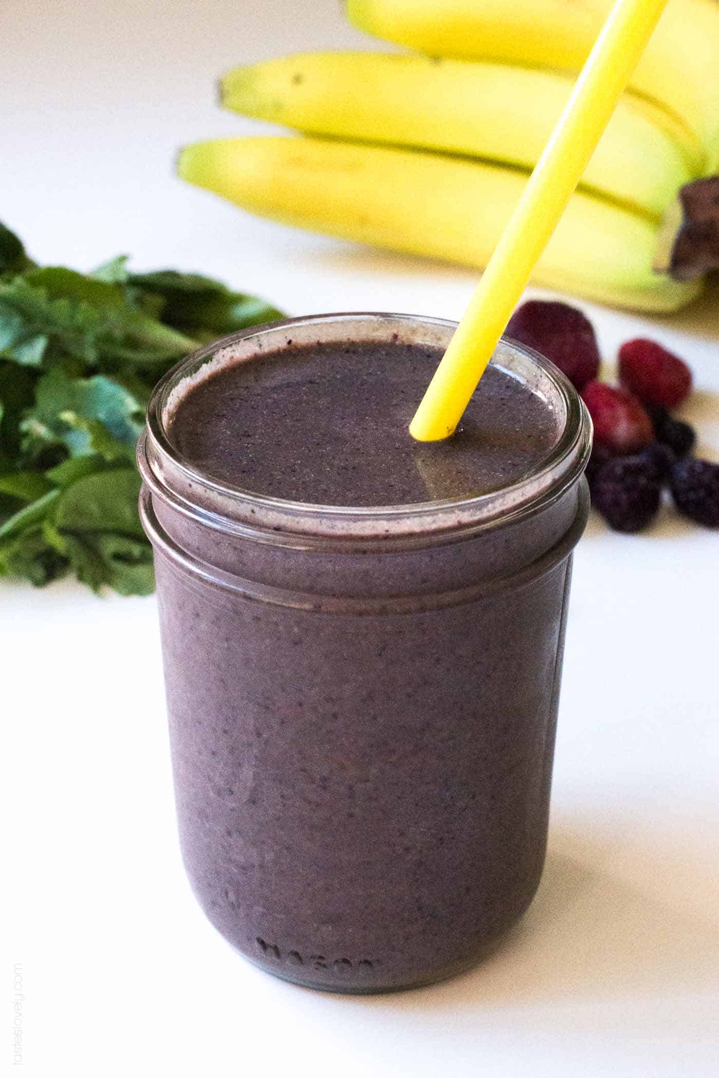 closeup of glass mason jar filled with a superfoods smoothie