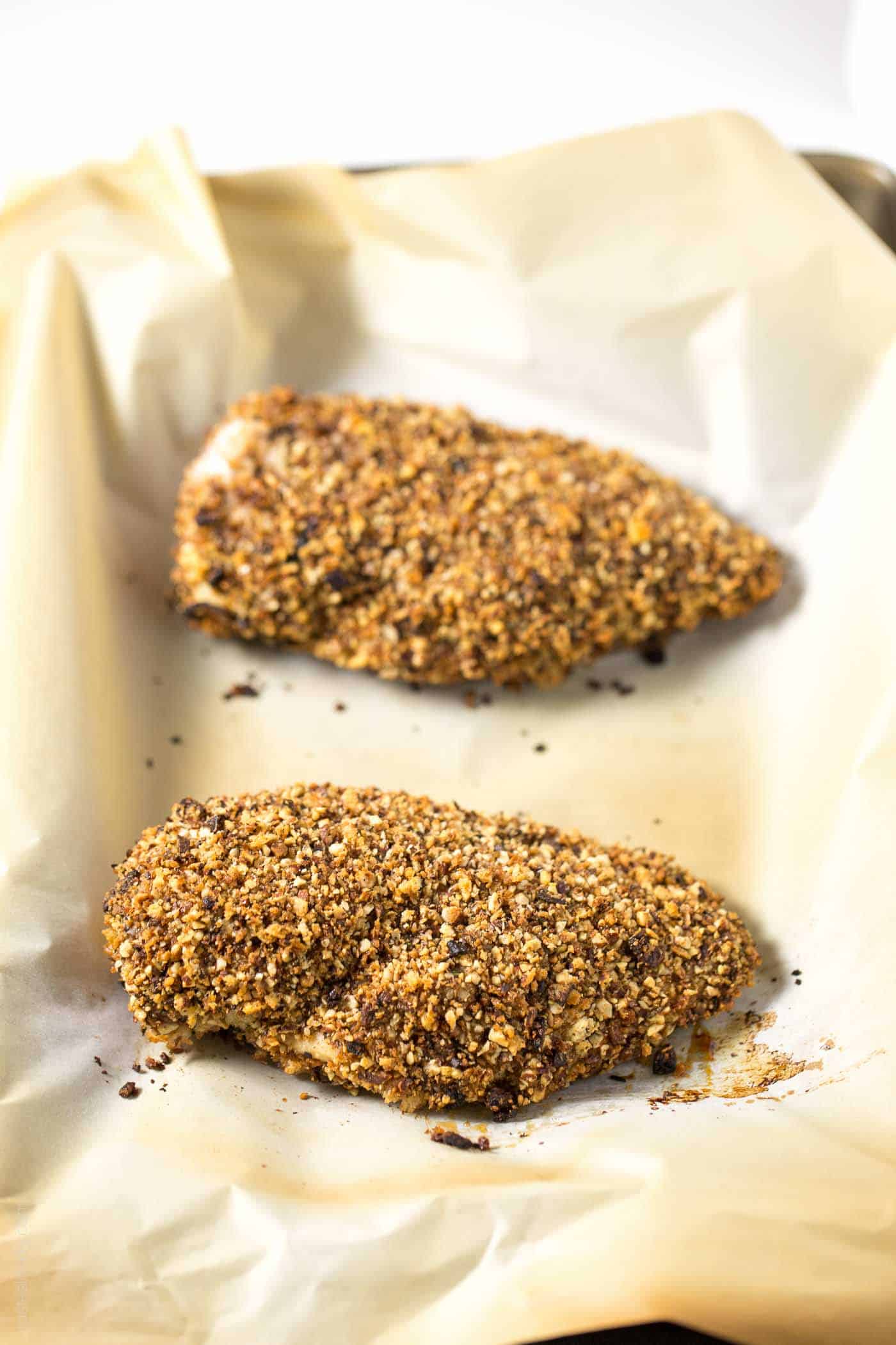 two chicken breasts on a baking sheet