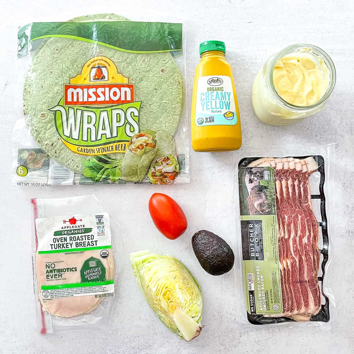 ingredients for to make a club sandwich in a spinach tortilla