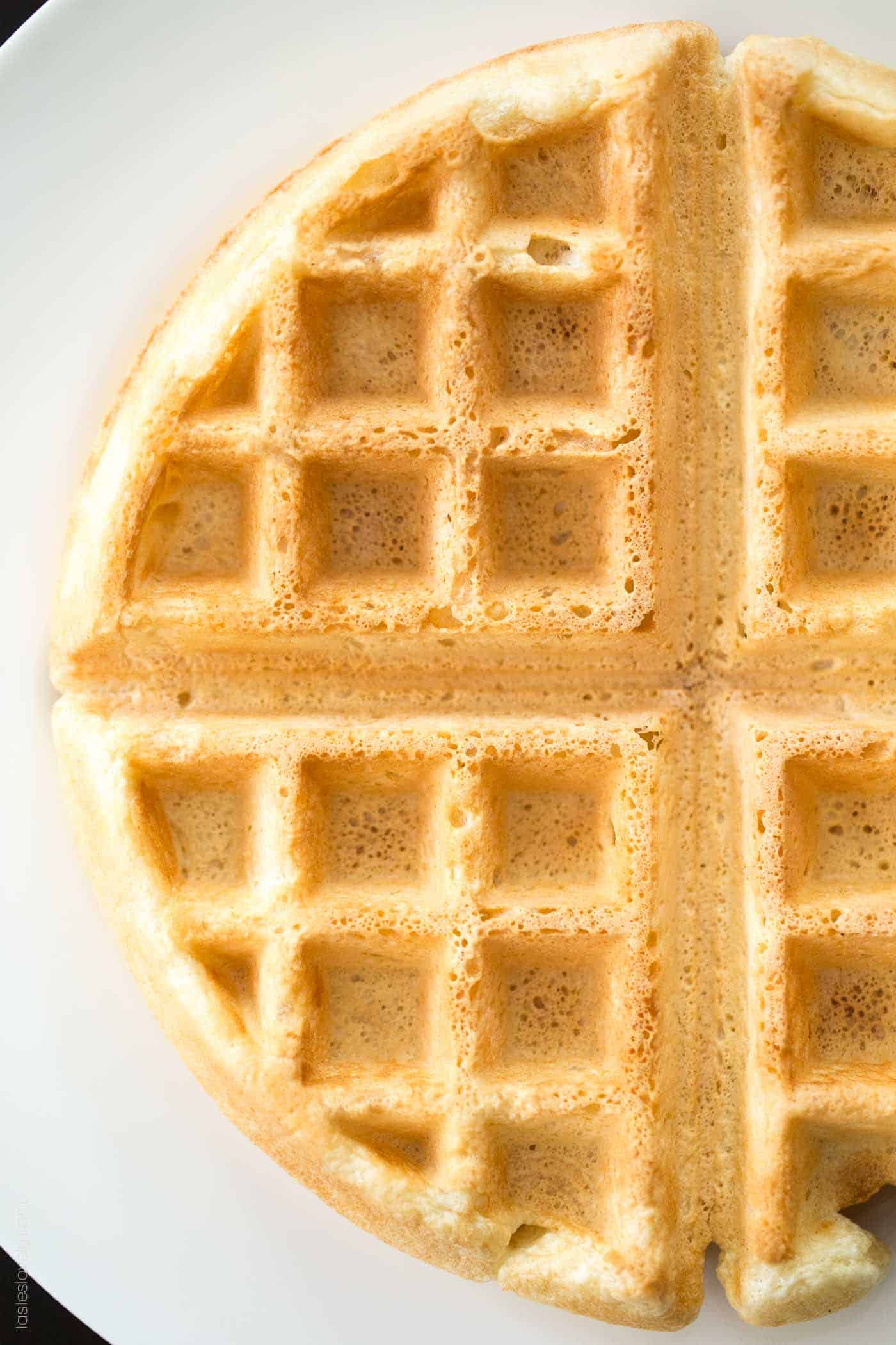 an up close photo of a waffle right out of the iron. 