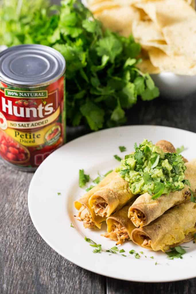 Baked Shredded Chicken Taquitos - juicy Mexican shredded chicken made in the slow cooker, then wrapped in corn tortillas, sprayed with olive oil, and baked in the oven. Great for an appetizer or dinner, and much healthier than fried!
