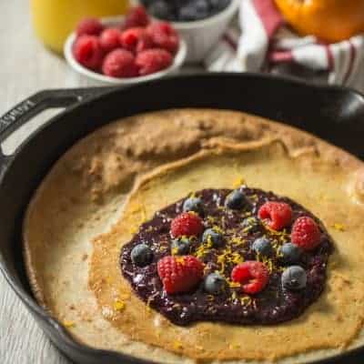 Paleo Dutch Baby with Orange Berry Compote | tasteslovely.com