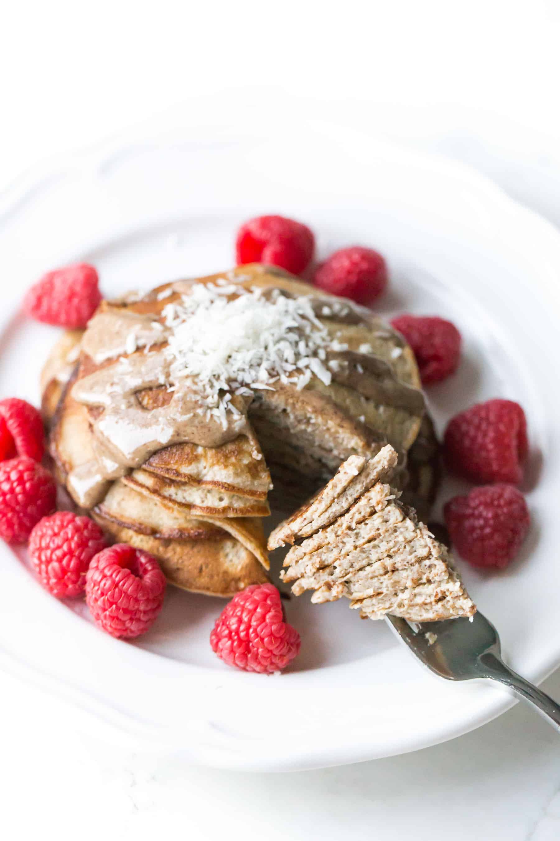 a fork holding a bite of banana pancakes