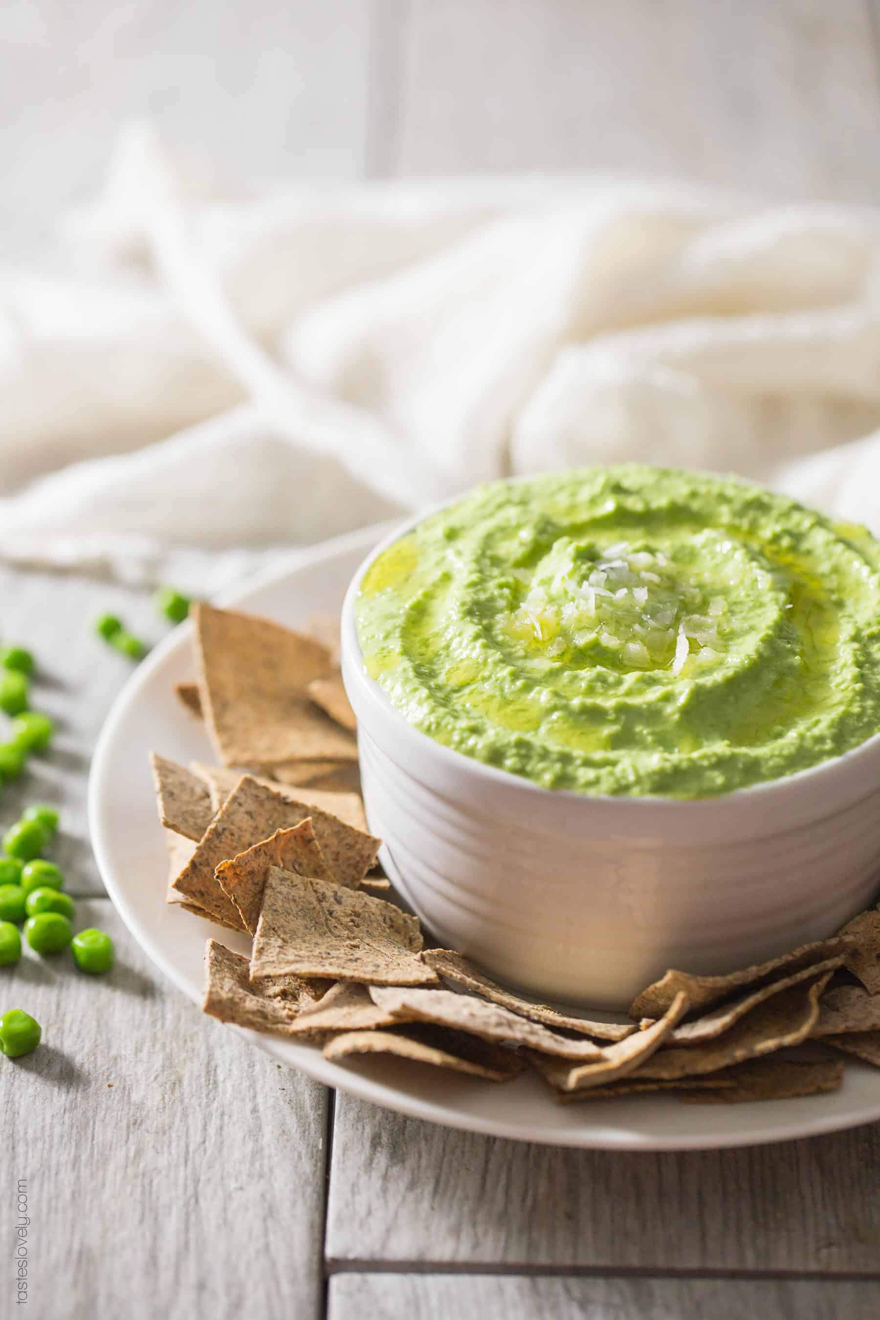 Paleo Sweet Pea No-Bean Hummus - a healthy spring appetizer served with my paleo almond pulp crackers. Paleo, gluten free, grain free, dairy free, sugar free.