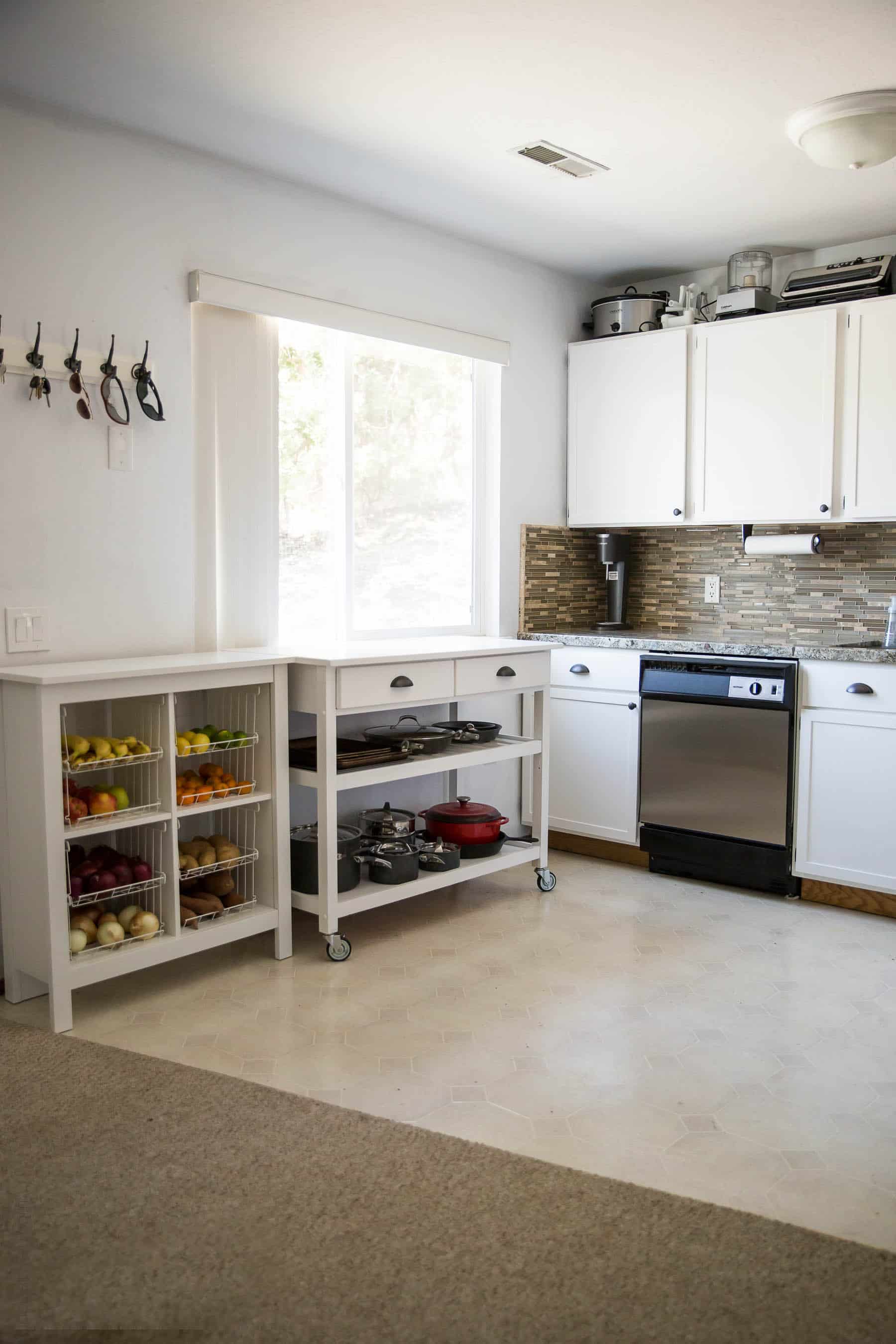 Our $281 DIY Kitchen Remodel - DIY painting oak cabinets white, adding wood trim to make shaker style cabinets, and adding hardware