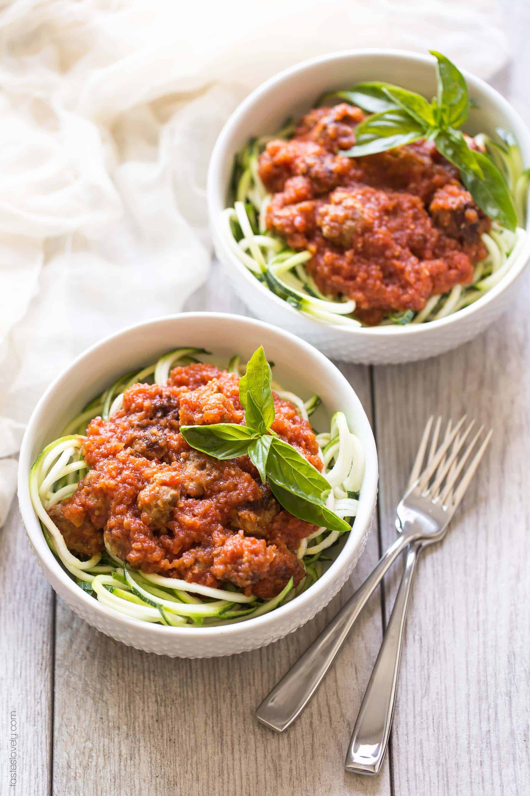 Homemade paleo & Whole30 marinara sauce, made from canned tomatoes with italian sausage. Served over zucchini noodles. A healthy and delicious dinner recipe! Paleo, whole30, gluten free, grain free, dairy free, sugar free, clean eating.