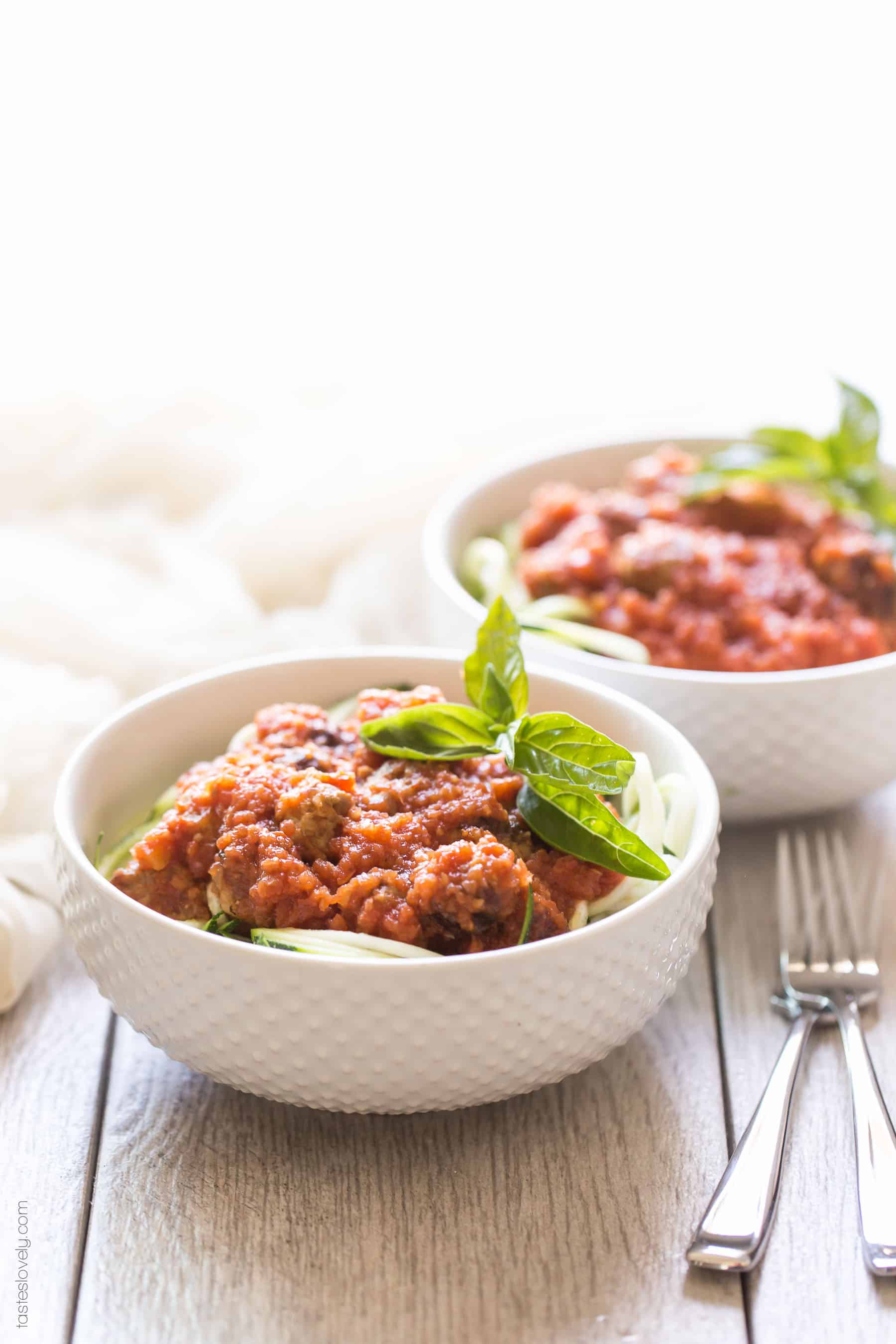Homemade paleo & Whole30 marinara sauce, made from canned tomatoes with italian sausage. Served over zucchini noodles. A healthy and delicious dinner recipe! Paleo, whole30, gluten free, grain free, dairy free, sugar free, clean eating.