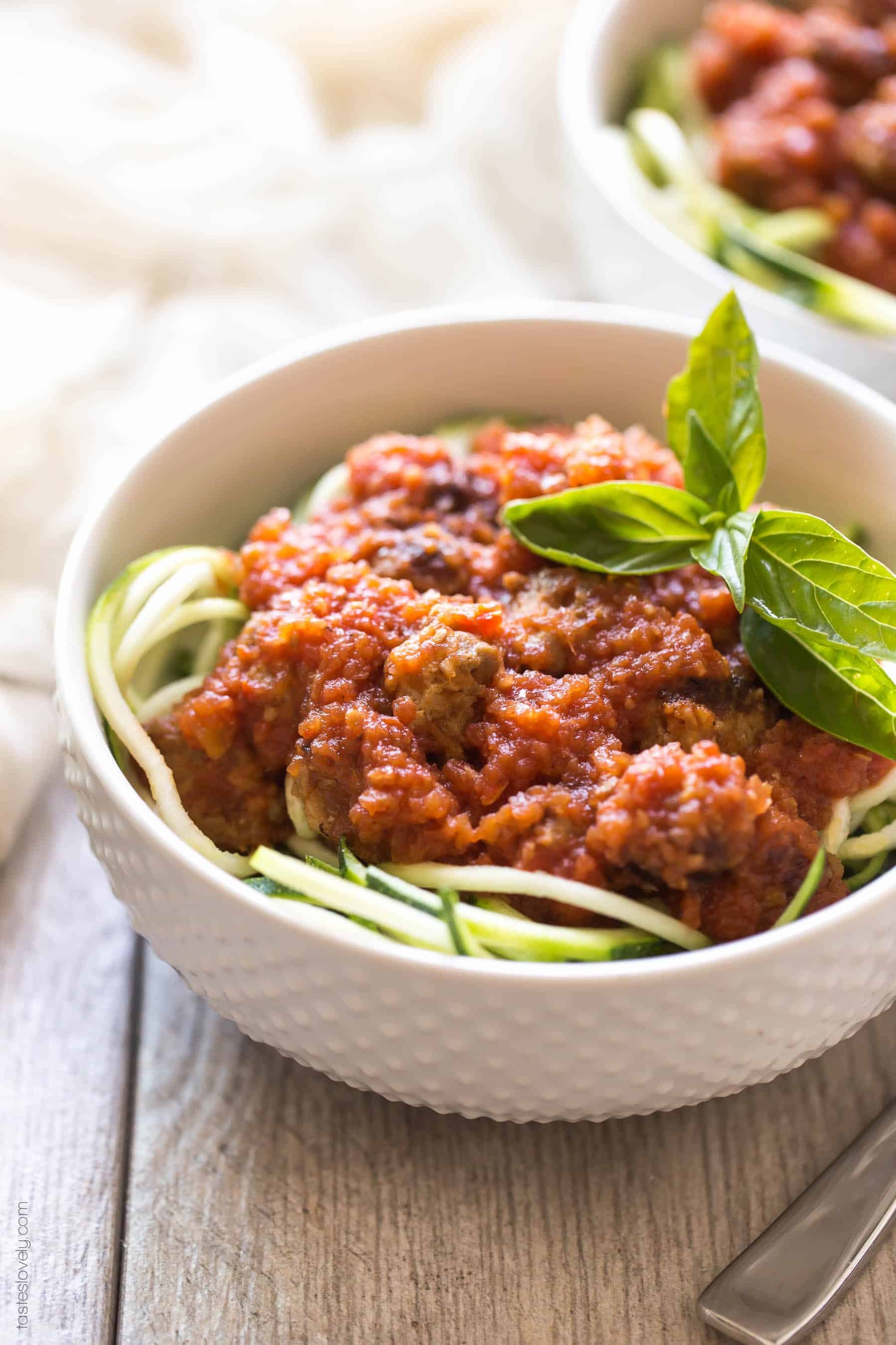 Homemade paleo & Whole30 marinara sauce, made from canned tomatoes with italian sausage. Served over zucchini noodles. A healthy and delicious dinner recipe! Paleo, whole30, gluten free, grain free, dairy free, sugar free, clean eating.