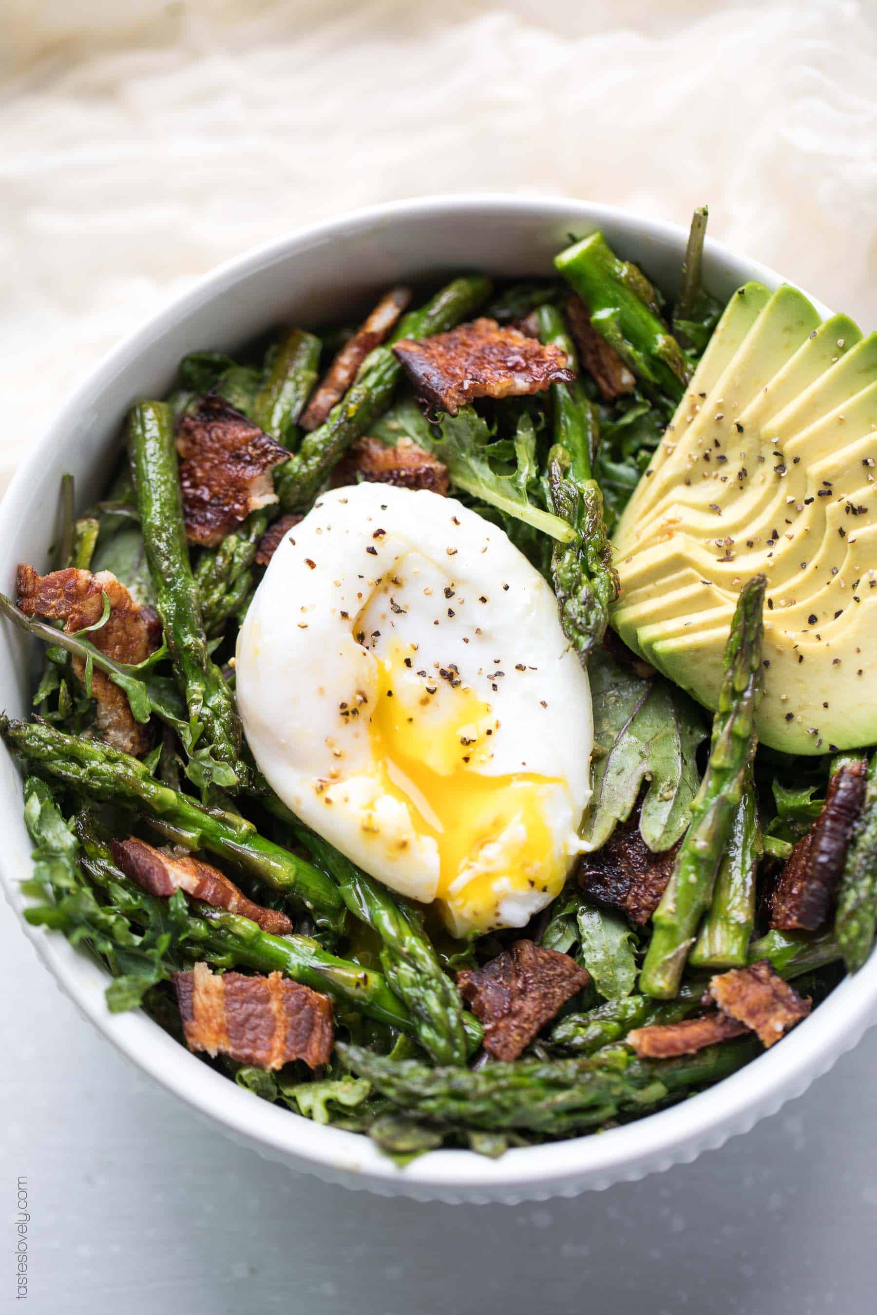 Paleo + Whole30 Brunch Kale Salad - baby kale tossed in an herby green dressing topped with bacon, asparagus and a poached egg (gluten free, grain free, dairy free, sugar free, clean eating)