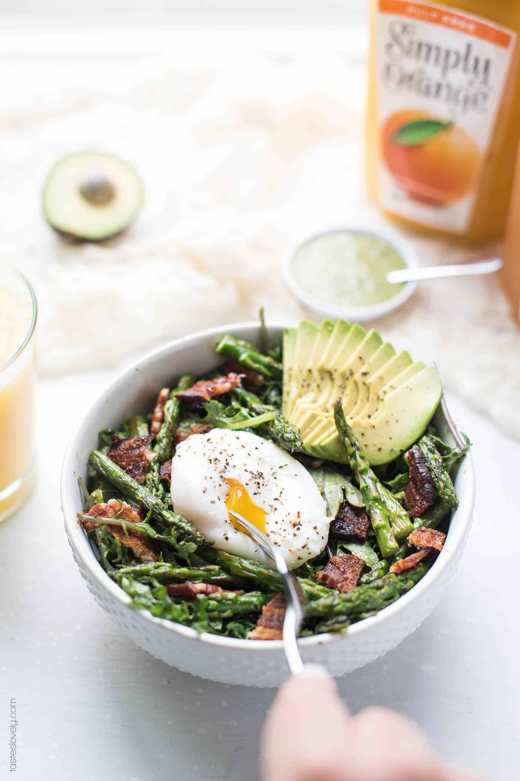 Paleo + Whole30 Brunch Kale Salad - baby kale tossed in an herby green dressing topped with bacon, asparagus and a poached egg (gluten free, grain free, dairy free, sugar free, clean eating)