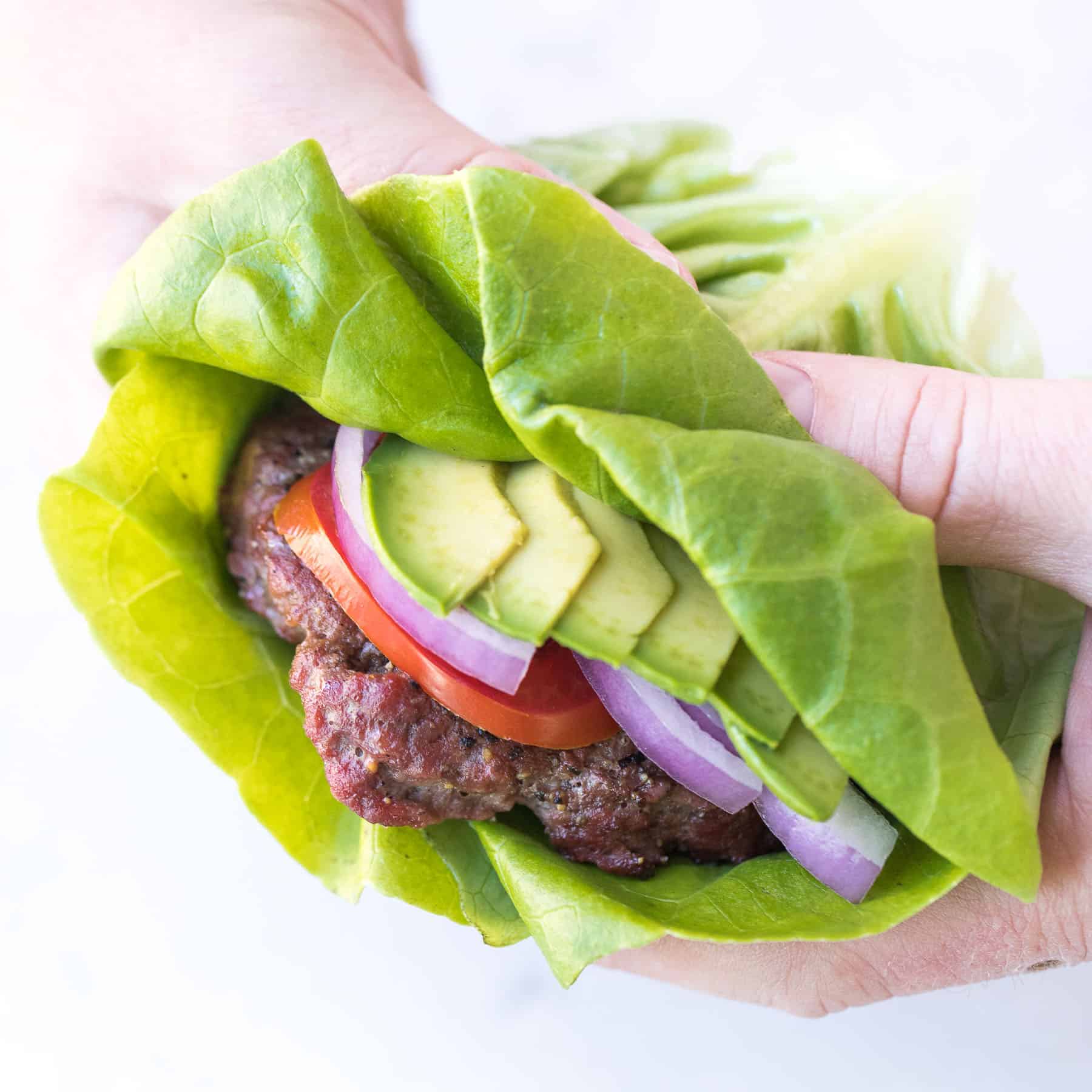 the perfect ketogenic burger on a lettuce wrap