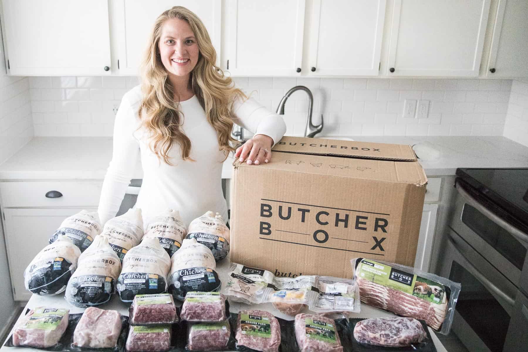 girl standing with a butcherbox order of meat