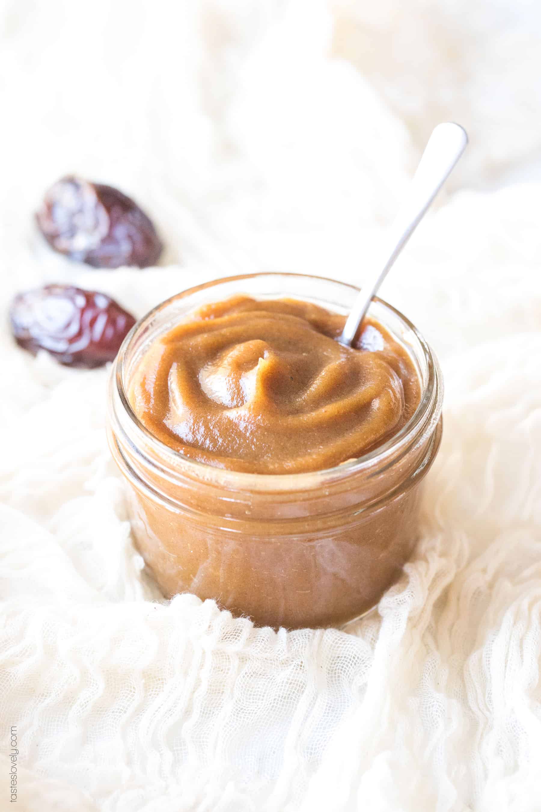 a glass mason jar filled with a natural sugar substitute with a silver spoon resting inside