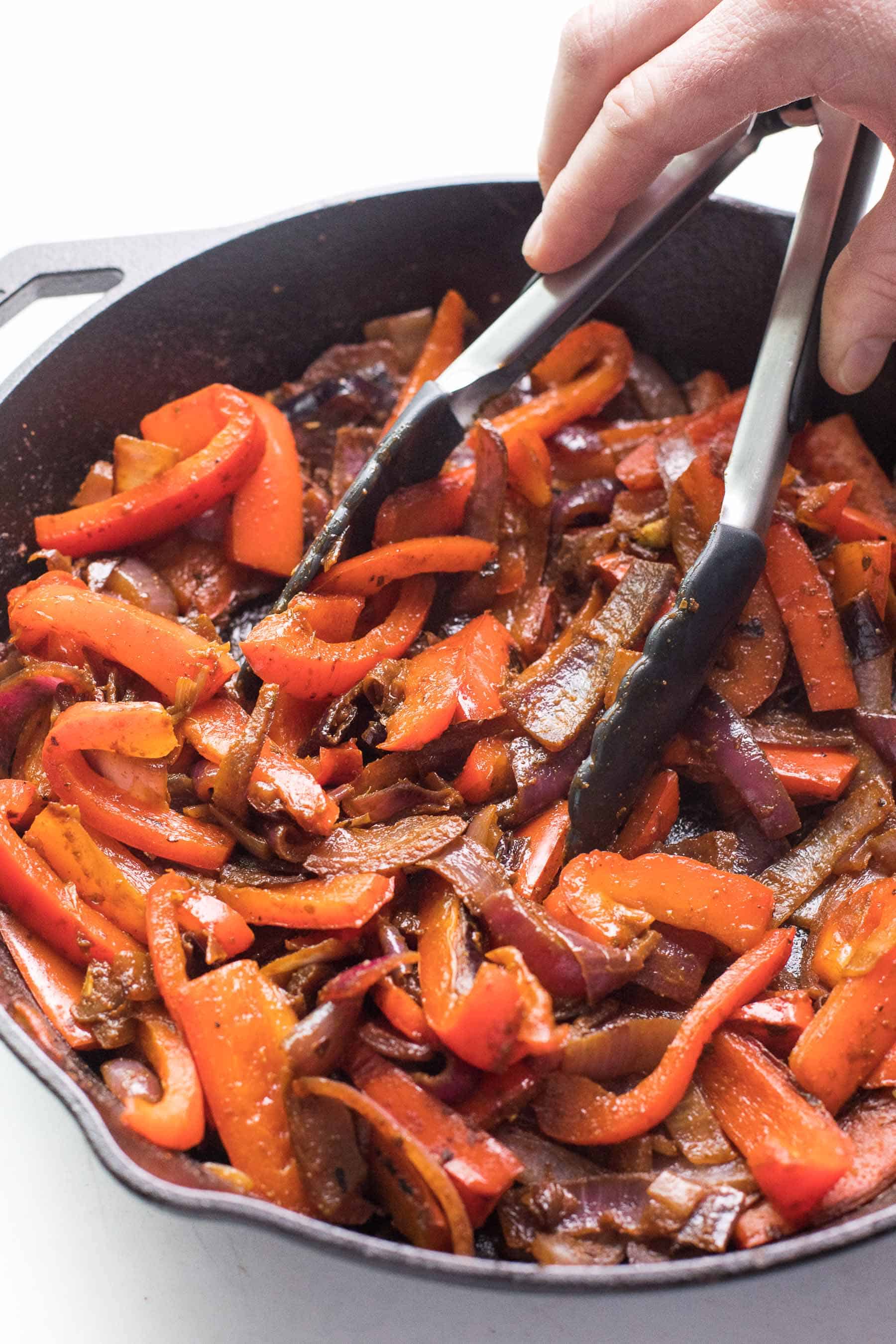 fajita veggies in a cast iron skillet