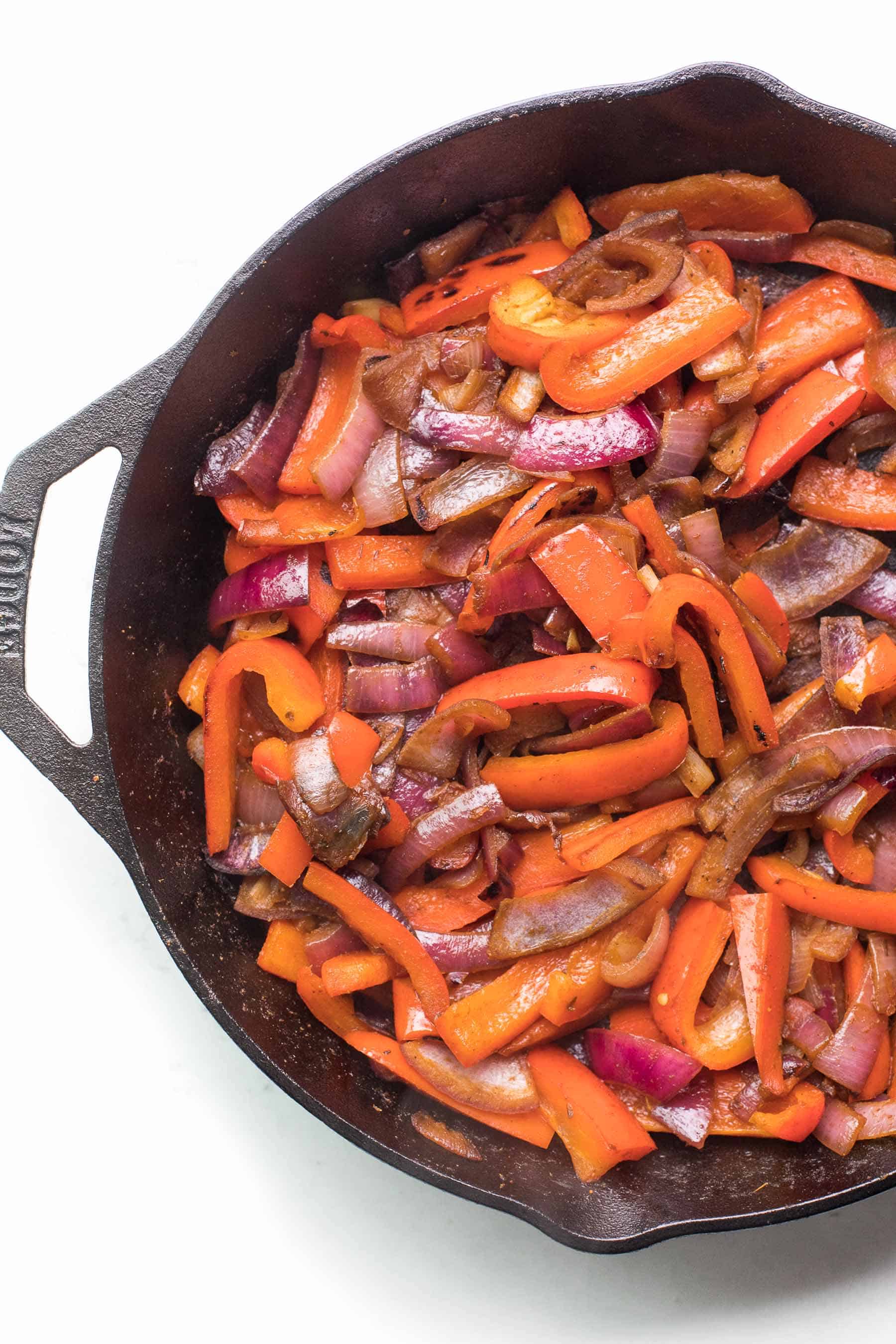 fajita veggies in a cast iron skillet