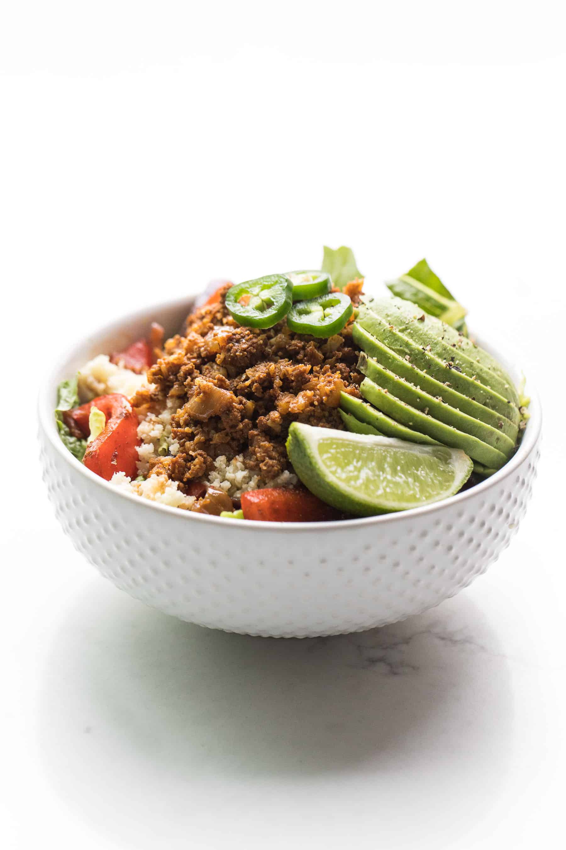 the contents of a beef burrito bowl in a white bowl 