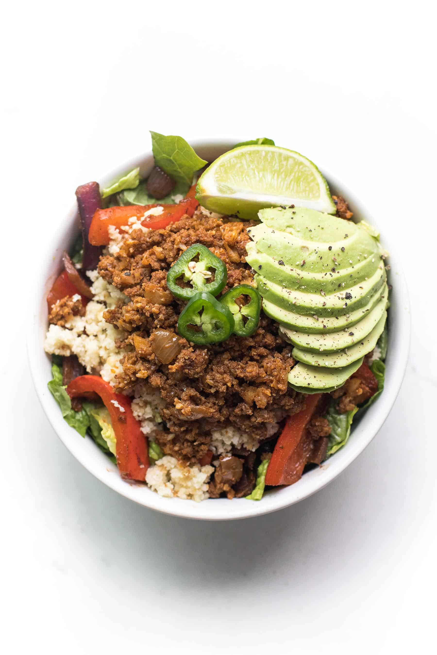 an overhead shot of a a beef burrito bowl recipe in a white bowl