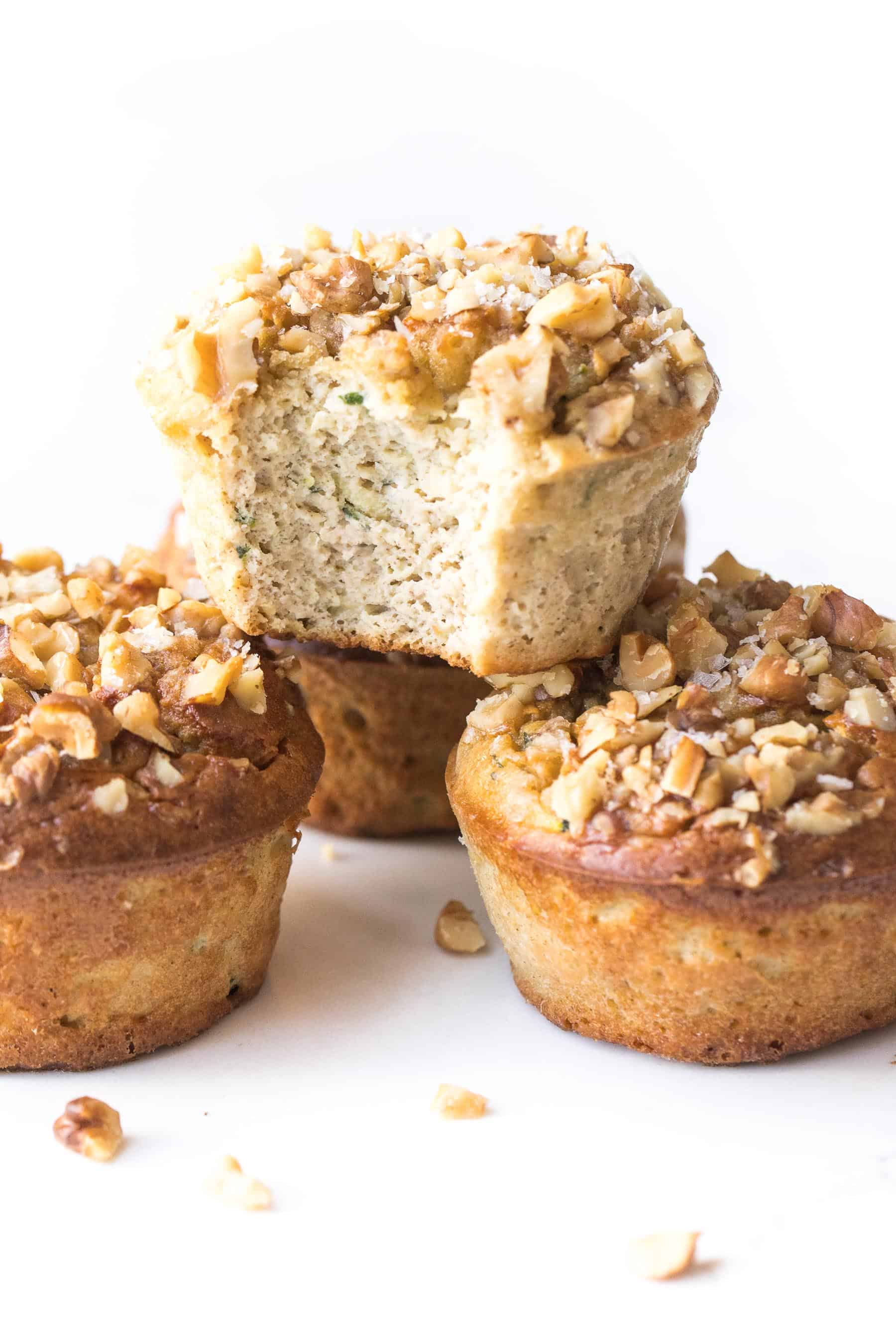 stack of paleo zucchini muffins on a white background