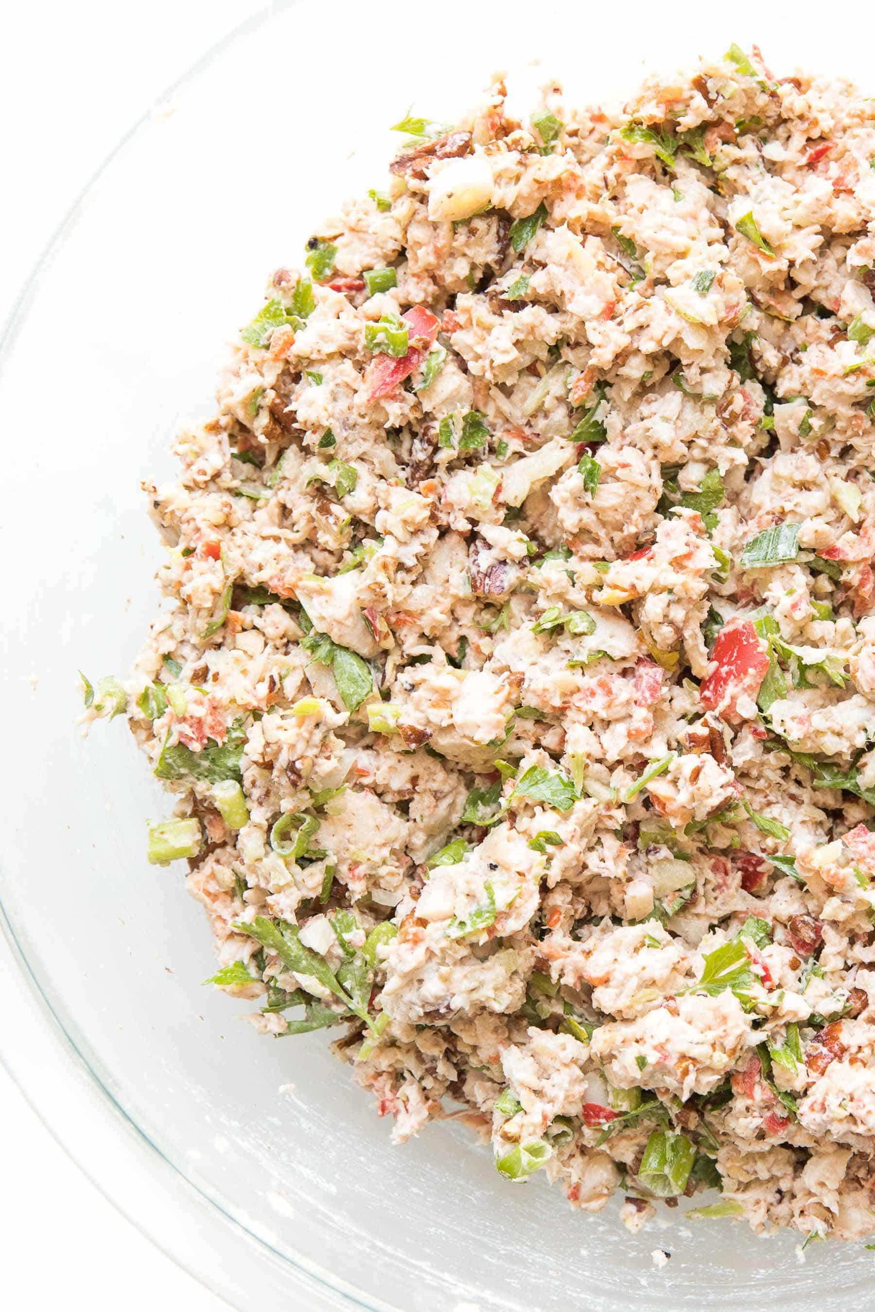 chicken salad in a bowl on a white background