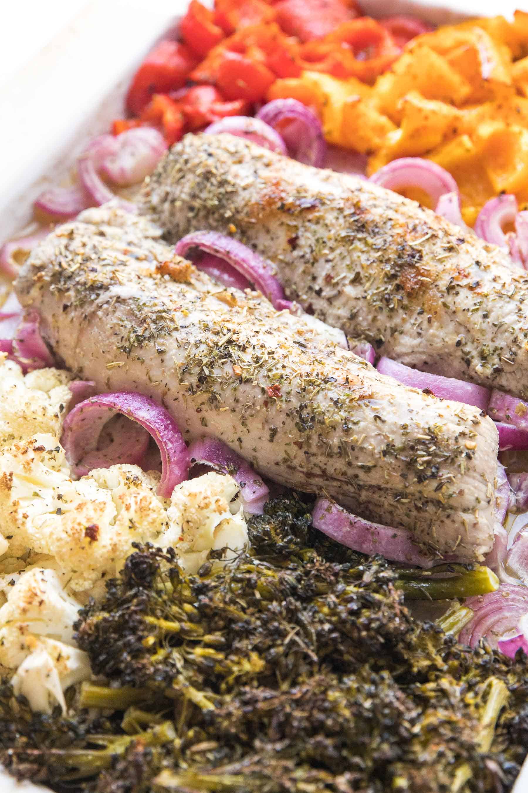 Pork tenderloin and rainbow vegetables on a sheet pan