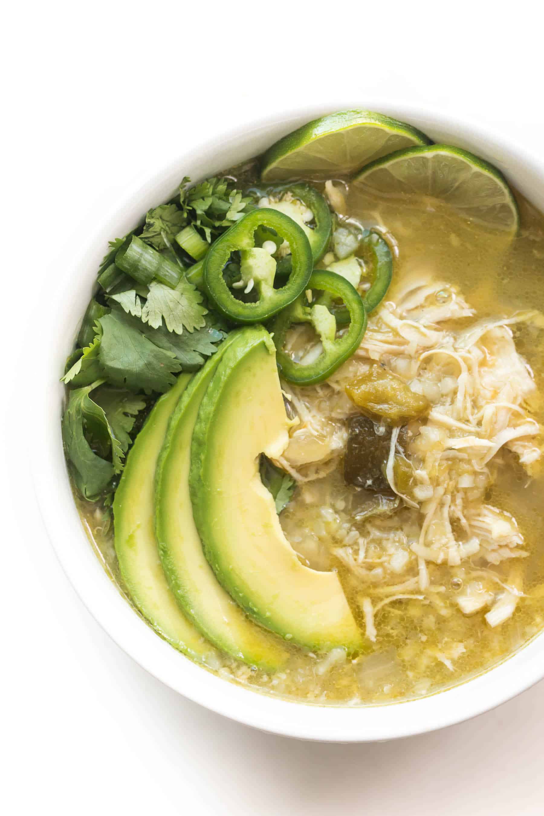green verde chicken chili in a white bowl on a white background