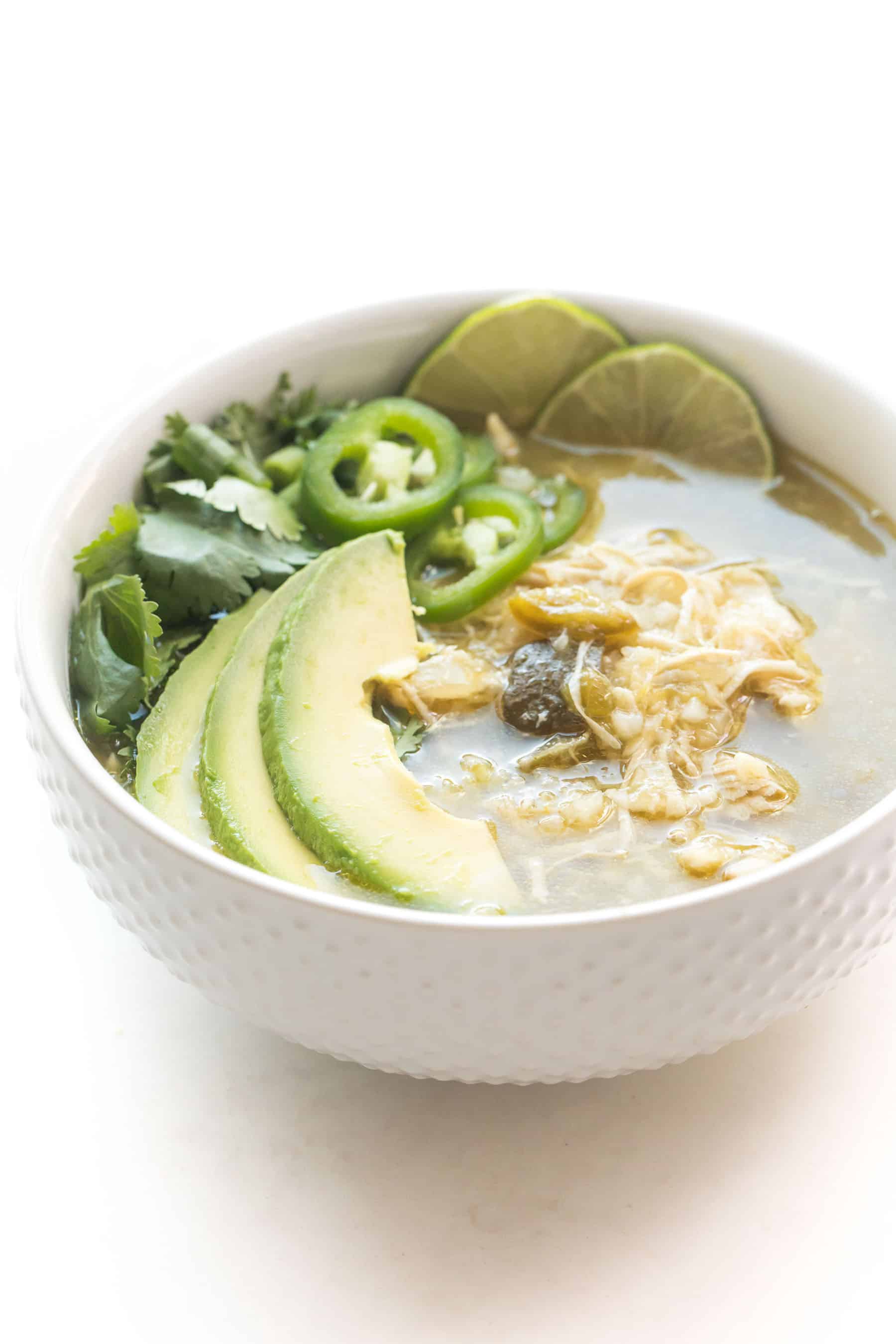 green verde chicken chili in a white bowl on a white background