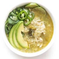 verde chicken chili in a white bowl on a white background