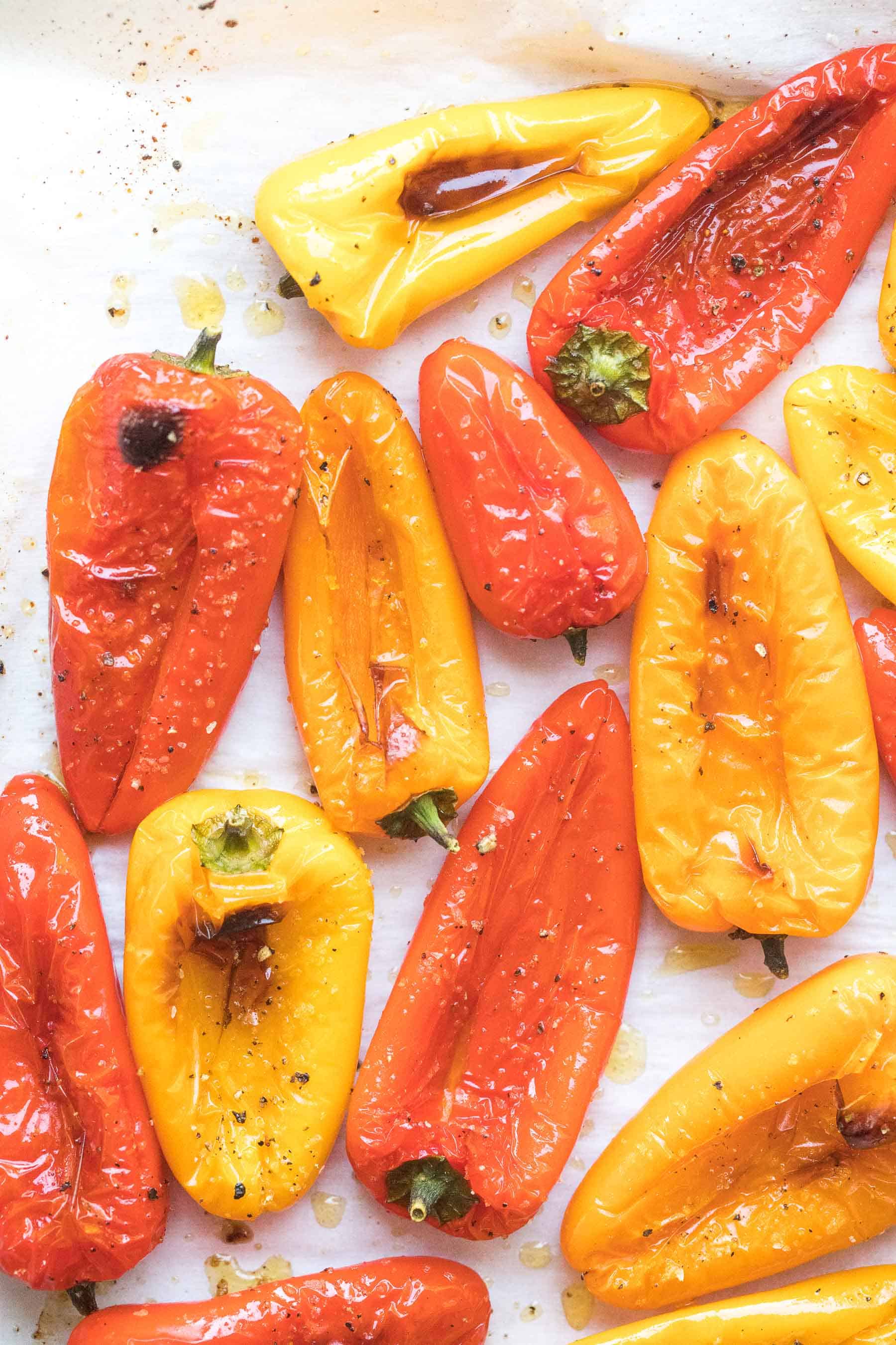 roasted mini bell peppers on parchment paper