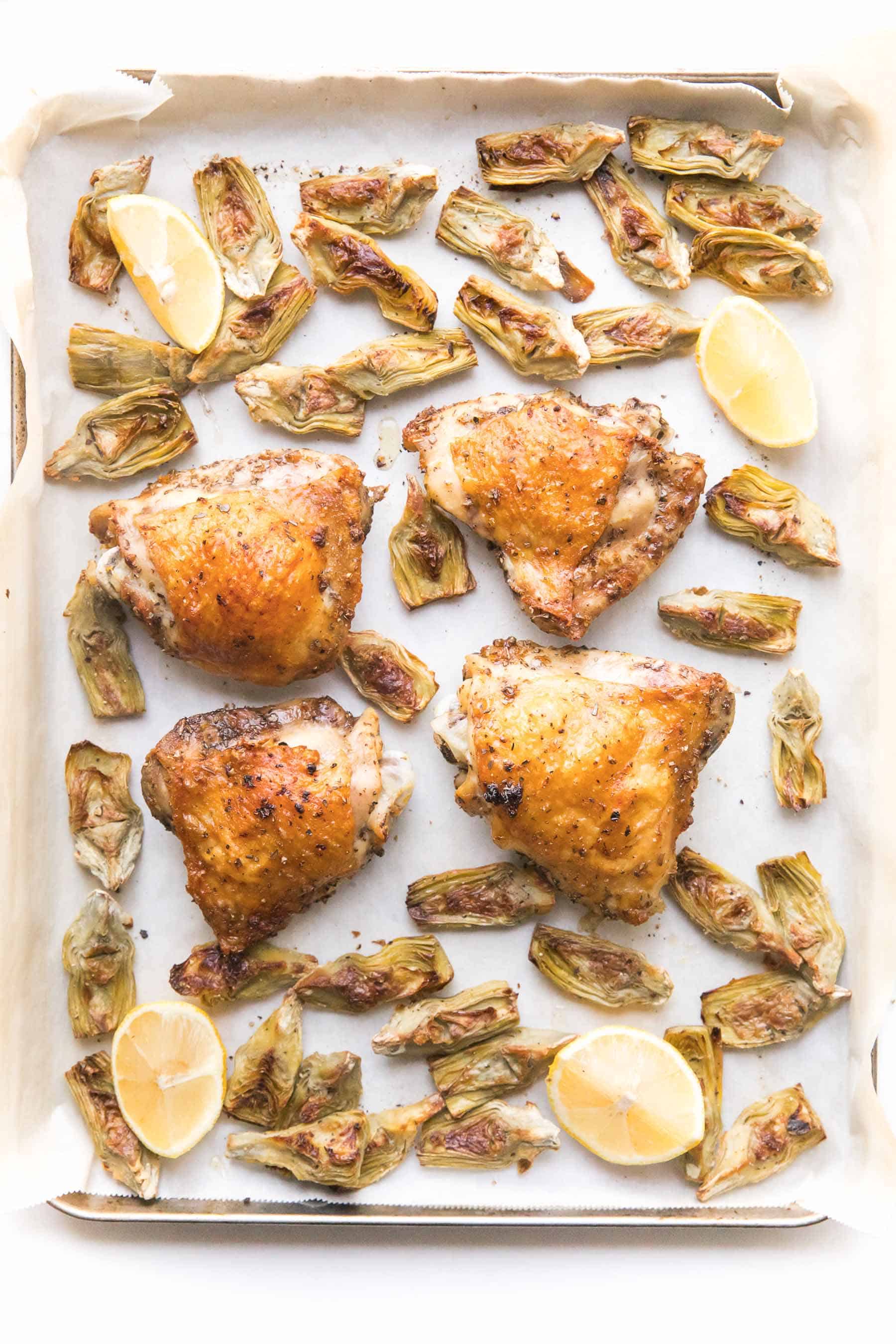 Roasted chicken and artichokes on a sheet pan