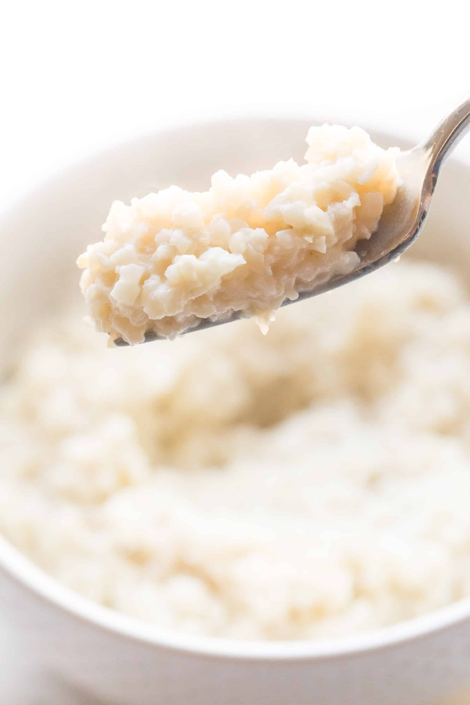 fork holding cauliflower rice risotto