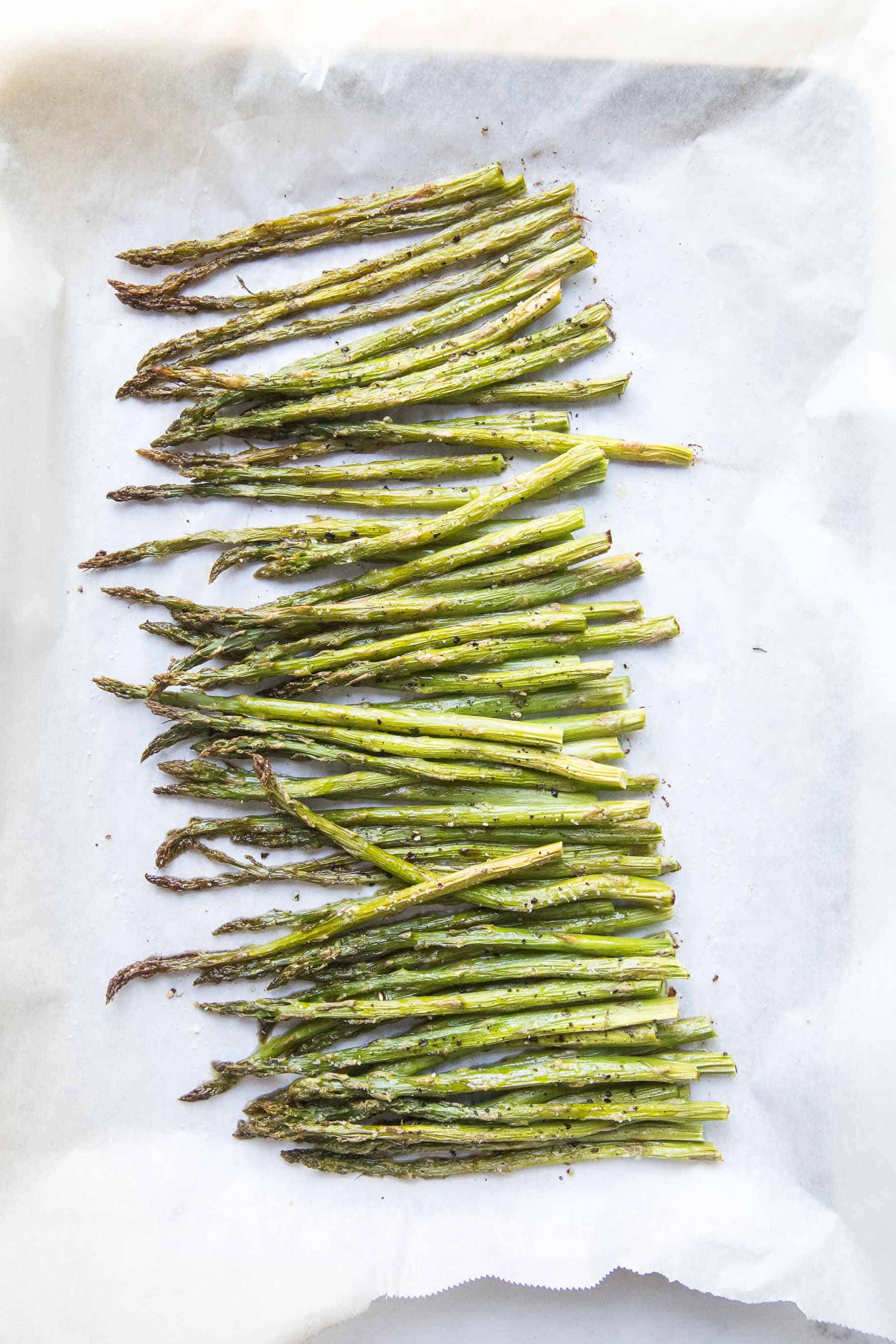 roasted asparagus on a rimmed baking sheet