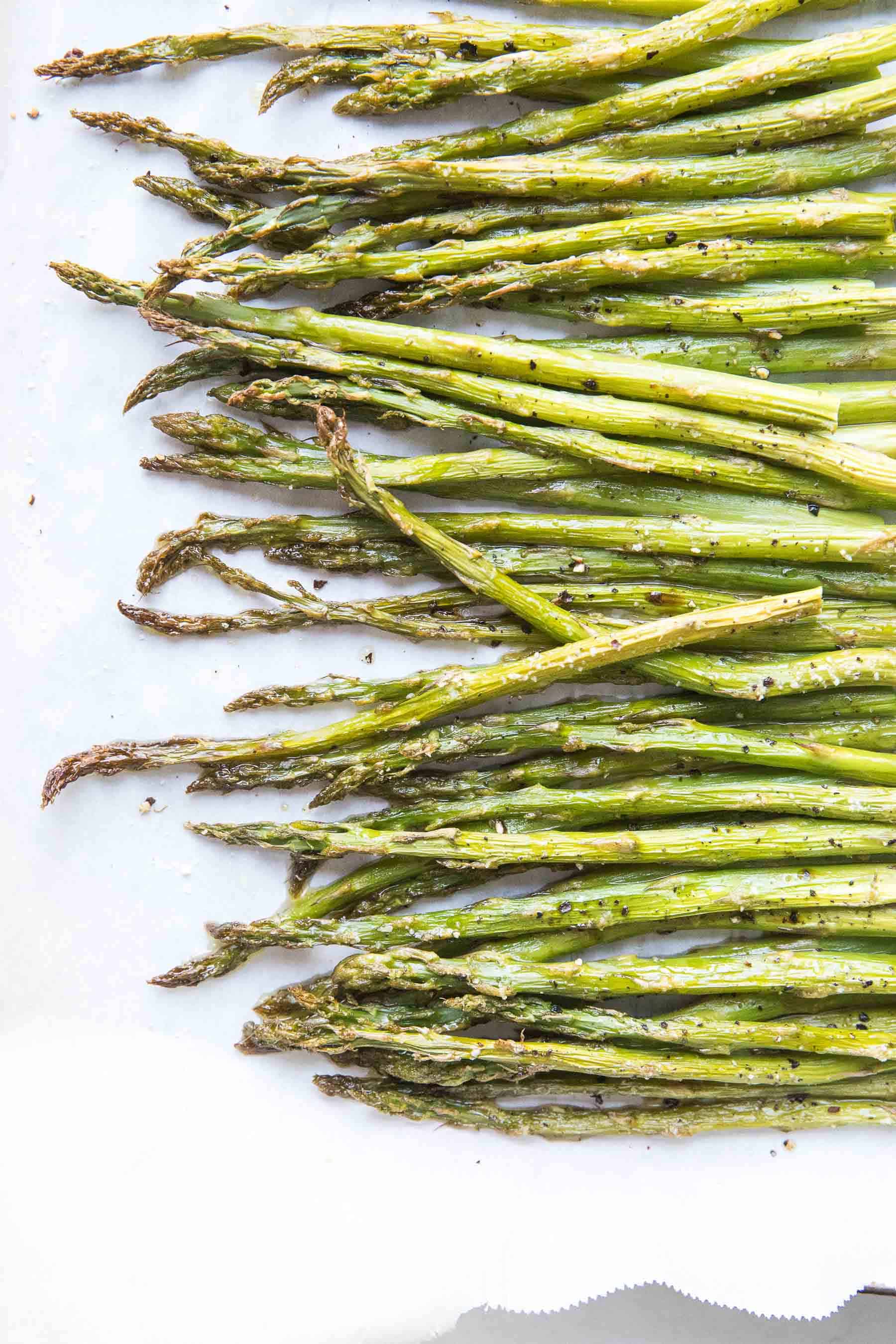 roasted asparagus on a rimmed baking sheet