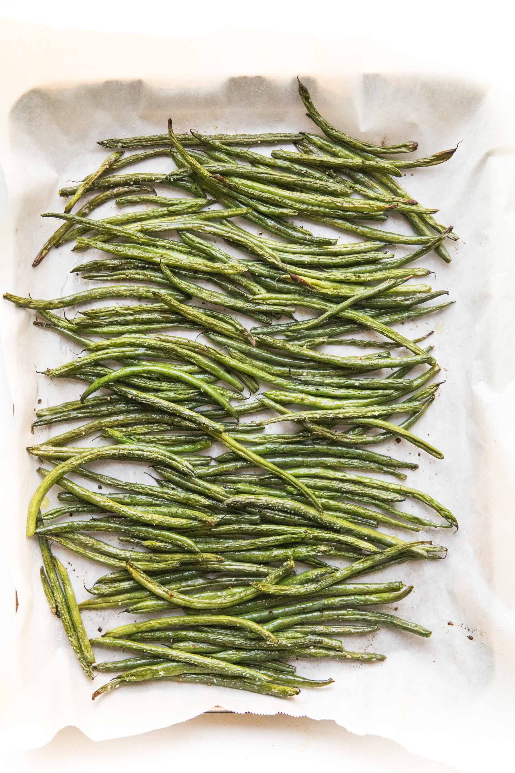 roasted green beans in a rimmed baking sheet