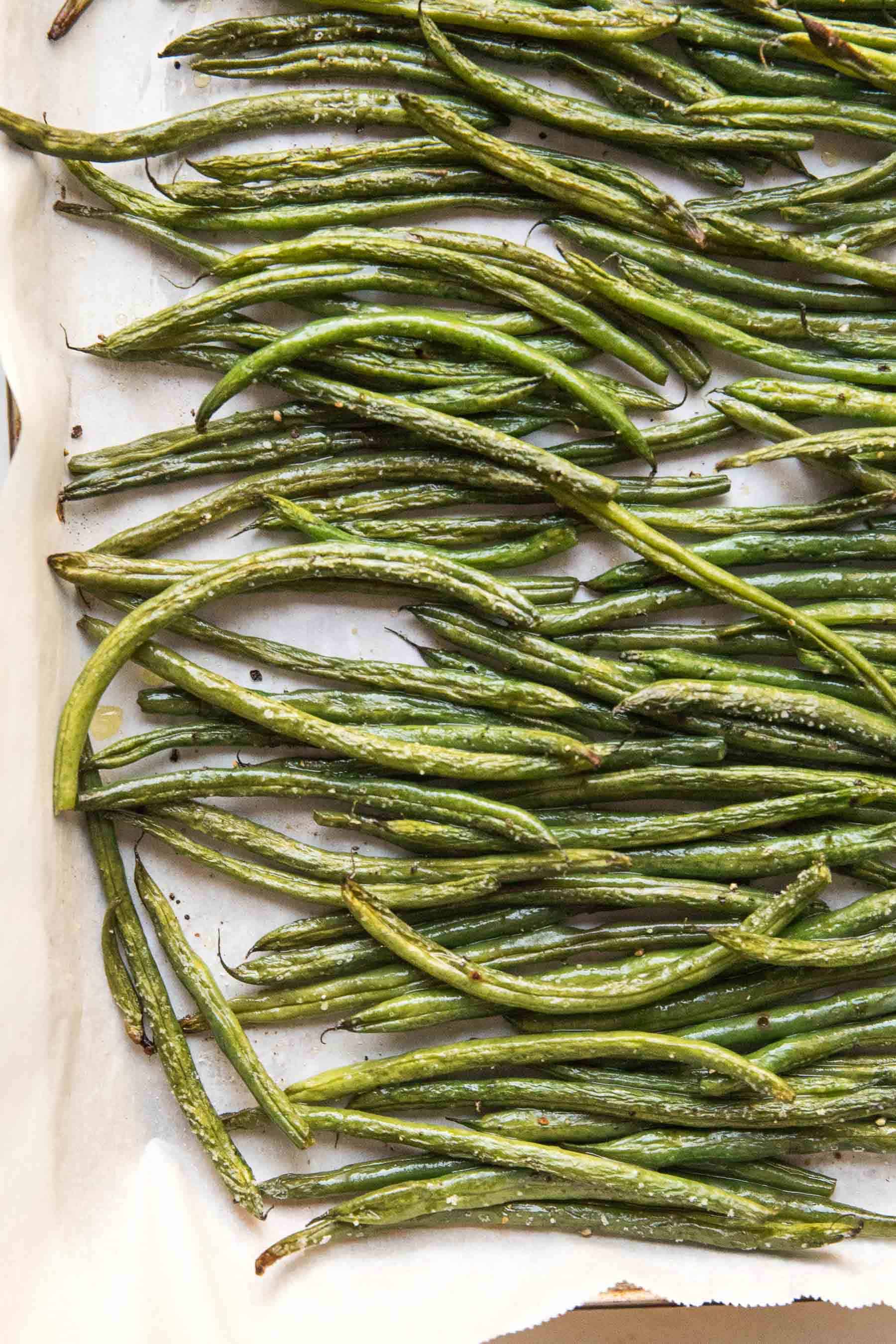 roasted green beans in a rimmed baking sheet